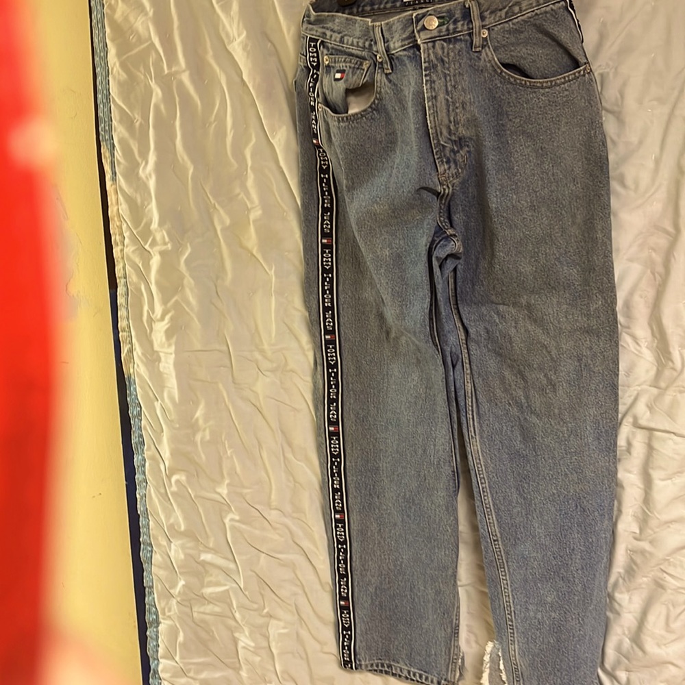 Tommy Hilfiger blue jeans with the stripes on sides of legs
